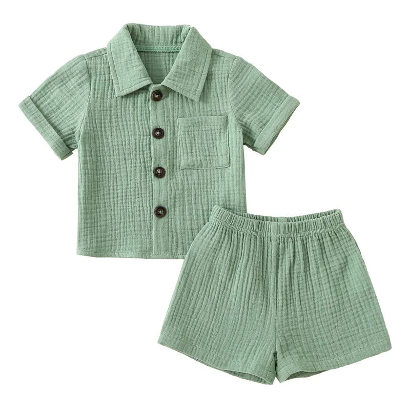 Solid short sleeve pocket button down lapel shirt and shorts set for babies in white, blue, and beige. Soft breathable fabric ideal for toddlers.