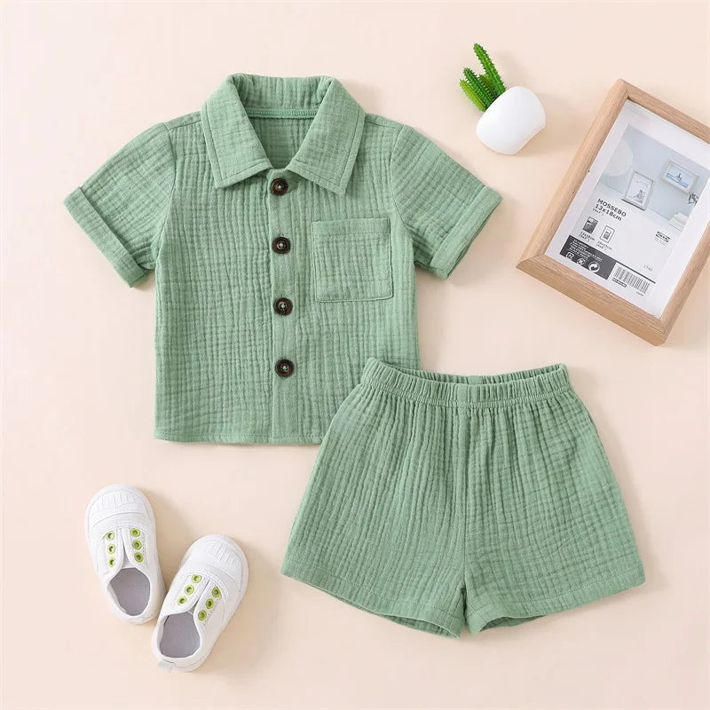 Solid short sleeve pocket button down lapel shirt and shorts set for babies in white, blue, and beige. Soft breathable fabric ideal for toddlers.