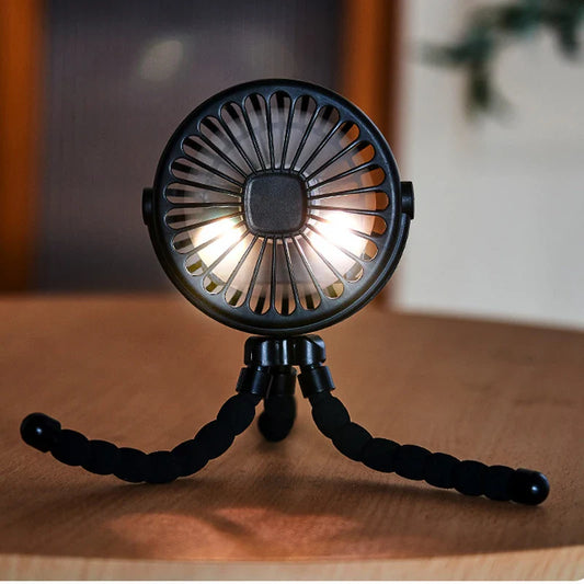 USB Rechargeable Handheld Electric Fan with flexible tripod legs and LED light, ideal for portable cooling on desks or travel use.