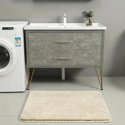 Anti-slip Bathroom Floor Mat in gray with plush texture, shown under bare feet for comfort and safety on wet bathroom floors.
