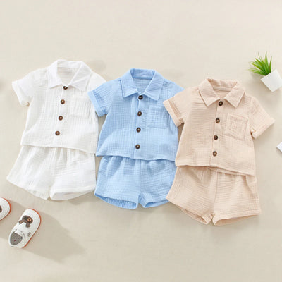 Solid short sleeve pocket button down lapel shirt and shorts set for babies in white, blue, and beige. Soft breathable fabric ideal for toddlers.