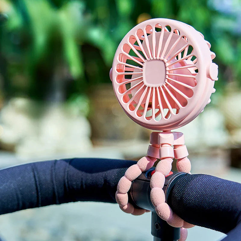 USB Rechargeable Handheld Electric Fan with flexible tripod legs and LED light, ideal for portable cooling on desks or travel use.