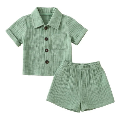 Solid short sleeve pocket button down lapel shirt and shorts set for babies in white, blue, and beige. Soft breathable fabric ideal for toddlers.