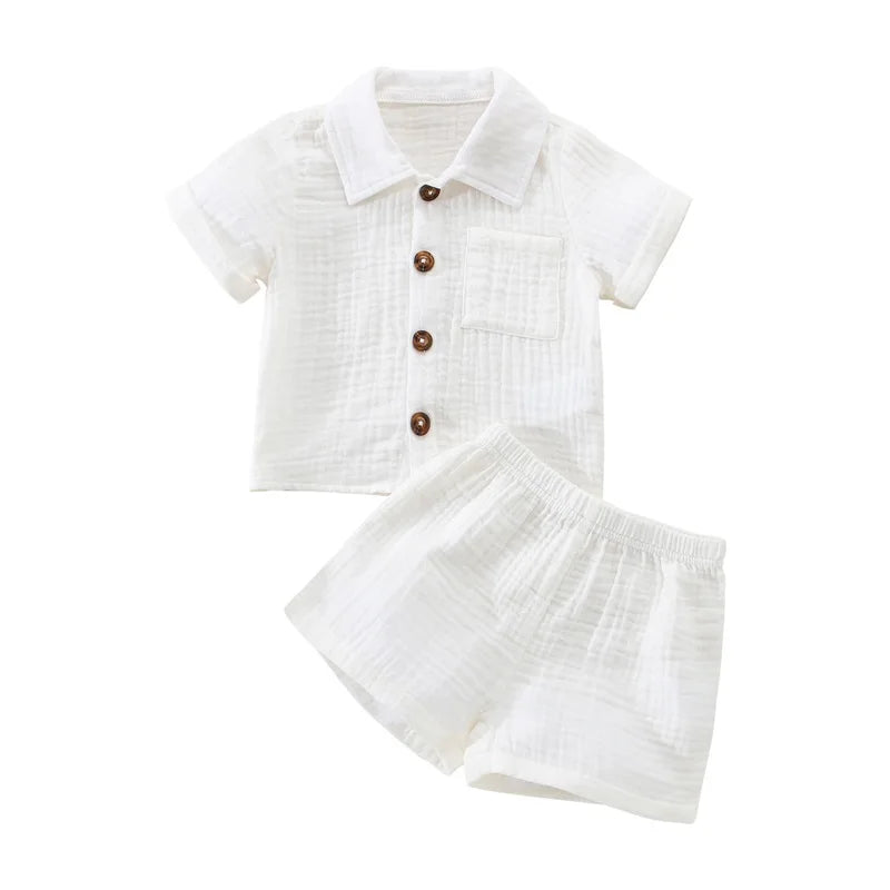 Solid short sleeve pocket button down lapel shirt and shorts set for babies in white, blue, and beige. Soft breathable fabric ideal for toddlers.