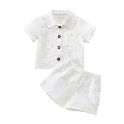 Solid short sleeve pocket button down lapel shirt and shorts set for babies in white, blue, and beige. Soft breathable fabric ideal for toddlers.