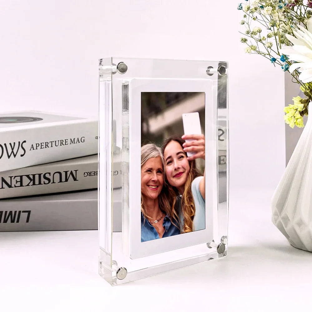 Acrylic Photo Frame - Type C Video Upload displays a winter photo of a mother and child. Clear digital frame with 480x854 IPS screen for vivid playback.