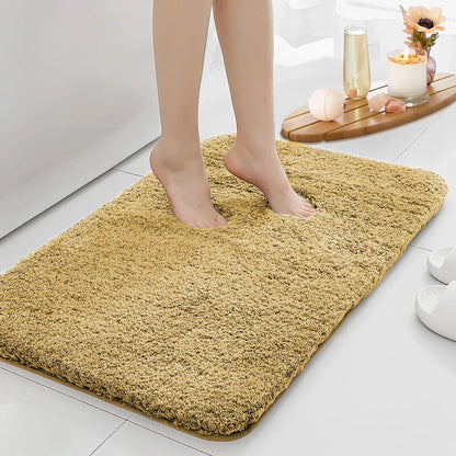Anti-slip Bathroom Floor Mat in gray with plush texture, shown under bare feet for comfort and safety on wet bathroom floors.