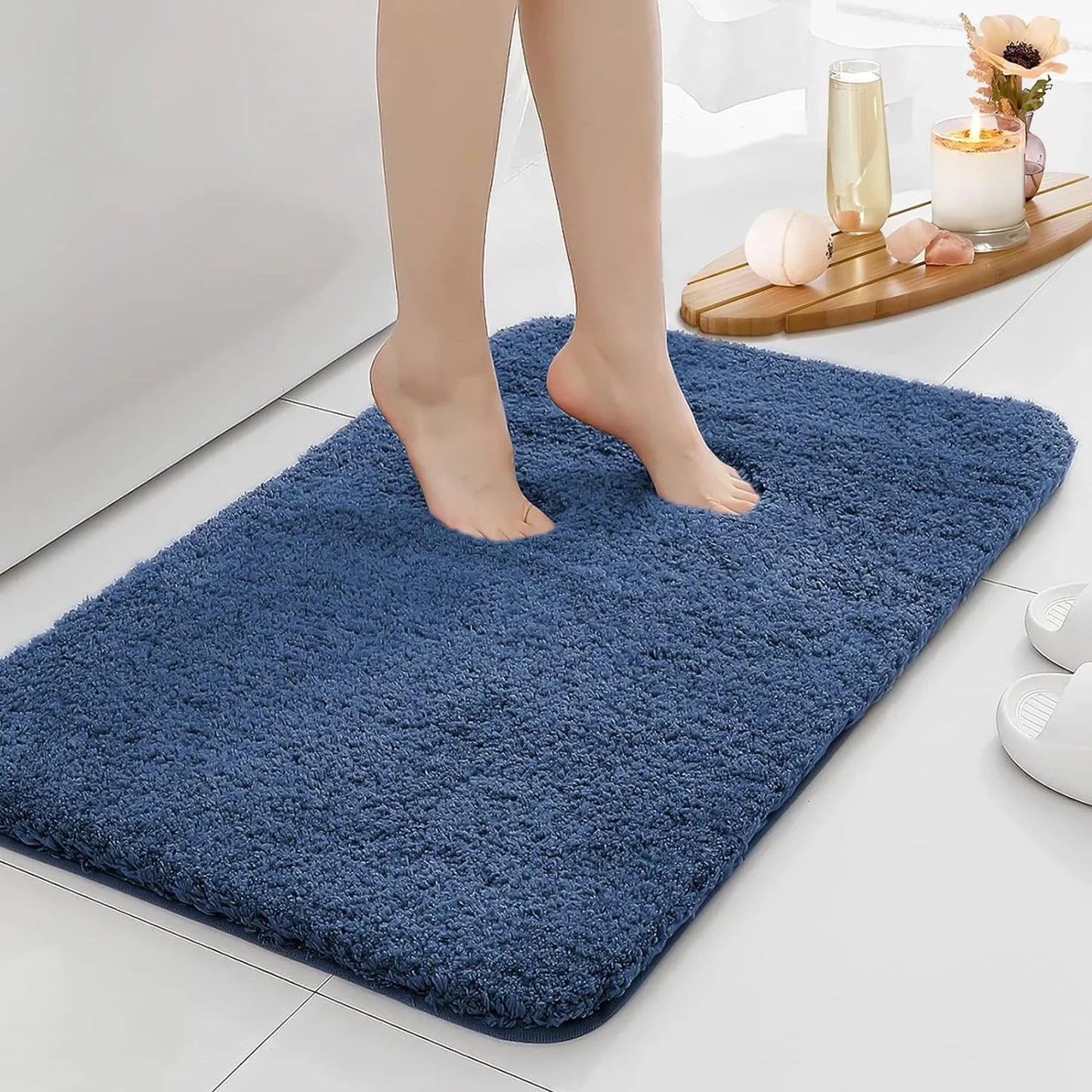 Anti-slip Bathroom Floor Mat in gray with plush texture, shown under bare feet for comfort and safety on wet bathroom floors.