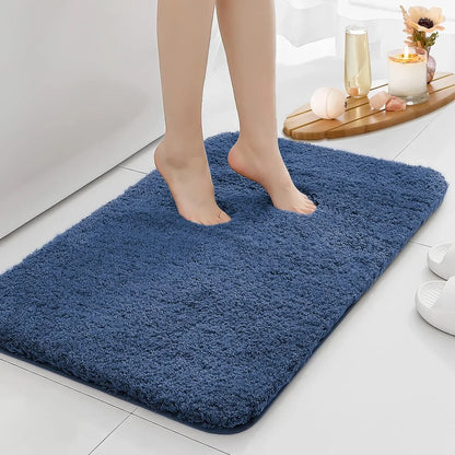 Anti-slip Bathroom Floor Mat in gray with plush texture, shown under bare feet for comfort and safety on wet bathroom floors.